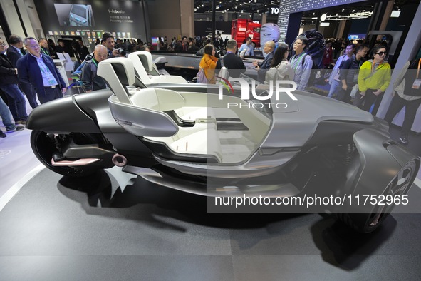 Visitors look at the Yamaha TRICERA electric three-wheel concept car at the 7th CIIE in Shanghai, China, on November 6, 2024. 