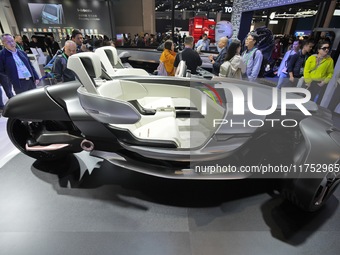 Visitors look at the Yamaha TRICERA electric three-wheel concept car at the 7th CIIE in Shanghai, China, on November 6, 2024. (