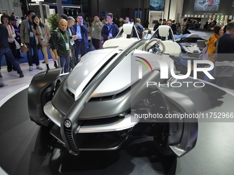 Visitors look at the Yamaha TRICERA electric three-wheel concept car at the 7th CIIE in Shanghai, China, on November 6, 2024. (