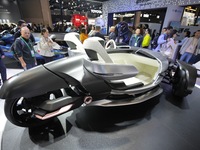 Visitors look at the Yamaha TRICERA electric three-wheel concept car at the 7th CIIE in Shanghai, China, on November 6, 2024. (