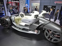 Visitors look at the Yamaha TRICERA electric three-wheel concept car at the 7th CIIE in Shanghai, China, on November 6, 2024. (