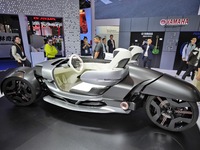 Visitors look at the Yamaha TRICERA electric three-wheel concept car at the 7th CIIE in Shanghai, China, on November 6, 2024. (