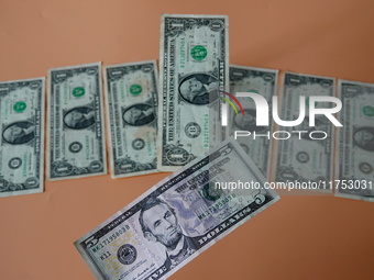 U.S. dollars are displayed in Yichang, Hubei province, China, on November 8, 2024. (