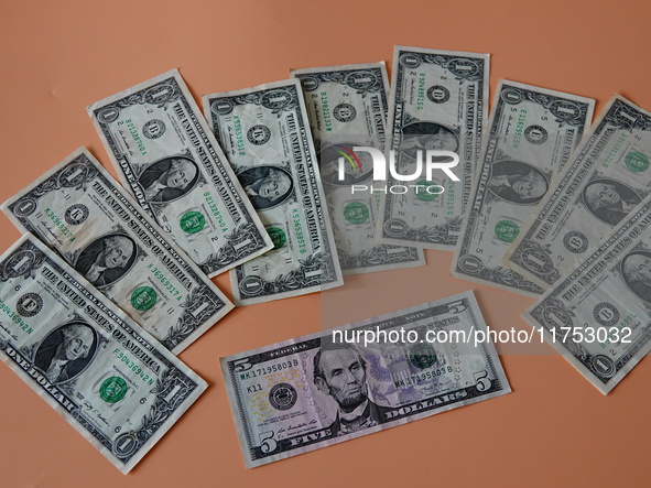 U.S. dollars are displayed in Yichang, Hubei province, China, on November 8, 2024. 