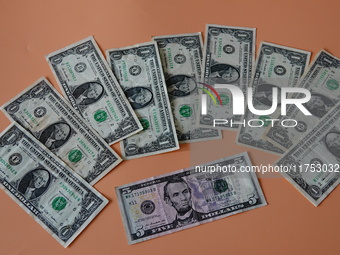 U.S. dollars are displayed in Yichang, Hubei province, China, on November 8, 2024. (