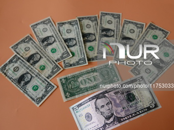 U.S. dollars are displayed in Yichang, Hubei province, China, on November 8, 2024. (