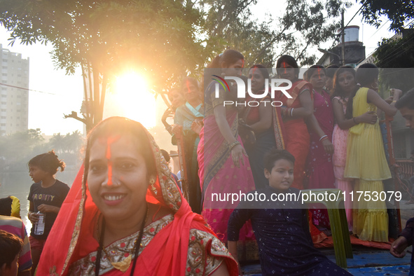 People celebrate the Chhath Puja festival in Kolkata, India, on November 8, 2024. 