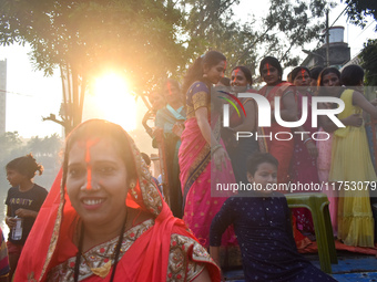 People celebrate the Chhath Puja festival in Kolkata, India, on November 8, 2024. (