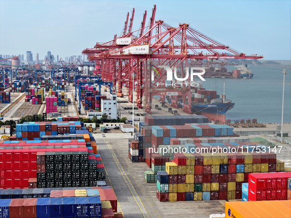 Cargo ships stop at their berths to load and unload containers at the container terminal in Lianyungang Port in Lianyungang, China, on Novem...