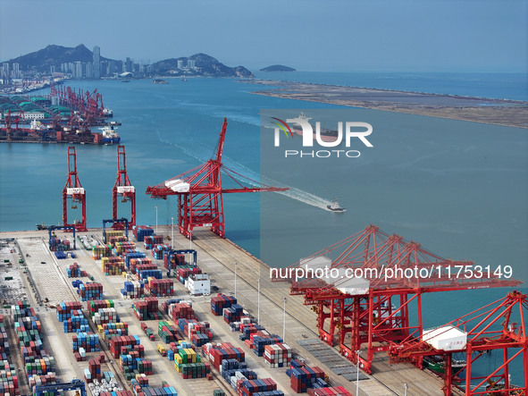 Cargo ships stop at their berths to load and unload containers at the container terminal in Lianyungang Port in Lianyungang, China, on Novem...