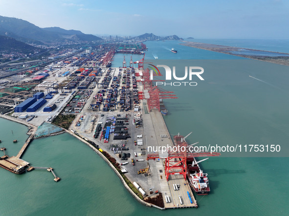 Cargo ships stop at their berths to load and unload containers at the container terminal in Lianyungang Port in Lianyungang, China, on Novem...