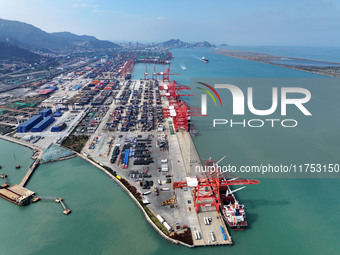 Cargo ships stop at their berths to load and unload containers at the container terminal in Lianyungang Port in Lianyungang, China, on Novem...