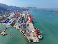 Cargo ships stop at their berths to load and unload containers at the container terminal in Lianyungang Port in Lianyungang, China, on Novem...