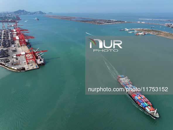 Cargo ships stop at their berths to load and unload containers at the container terminal in Lianyungang Port in Lianyungang, China, on Novem...