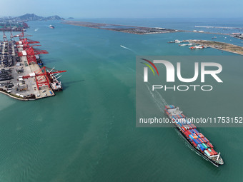 Cargo ships stop at their berths to load and unload containers at the container terminal in Lianyungang Port in Lianyungang, China, on Novem...