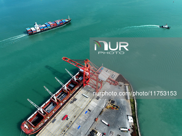 Cargo ships stop at their berths to load and unload containers at the container terminal in Lianyungang Port in Lianyungang, China, on Novem...