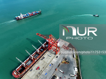 Cargo ships stop at their berths to load and unload containers at the container terminal in Lianyungang Port in Lianyungang, China, on Novem...