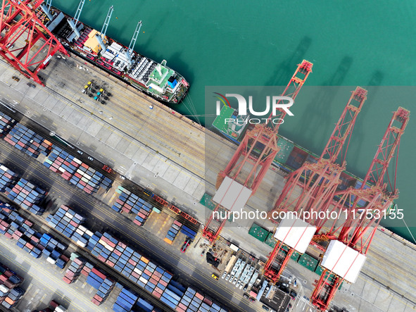 Cargo ships stop at their berths to load and unload containers at the container terminal in Lianyungang Port in Lianyungang, China, on Novem...