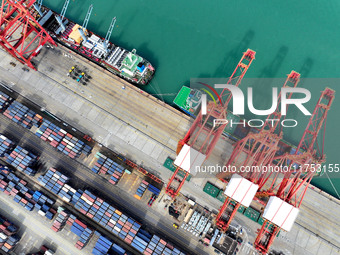 Cargo ships stop at their berths to load and unload containers at the container terminal in Lianyungang Port in Lianyungang, China, on Novem...