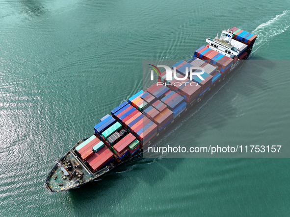 Cargo ships stop at their berths to load and unload containers at the container terminal in Lianyungang Port in Lianyungang, China, on Novem...