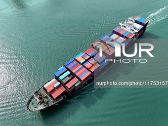 Cargo ships stop at their berths to load and unload containers at the container terminal in Lianyungang Port in Lianyungang, China, on Novem...