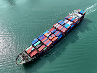 Cargo ships stop at their berths to load and unload containers at the container terminal in Lianyungang Port in Lianyungang, China, on Novem...