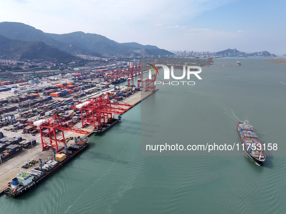 Cargo ships stop at their berths to load and unload containers at the container terminal in Lianyungang Port in Lianyungang, China, on Novem...