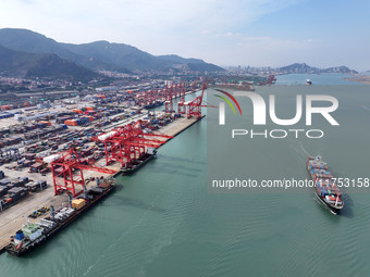 Cargo ships stop at their berths to load and unload containers at the container terminal in Lianyungang Port in Lianyungang, China, on Novem...