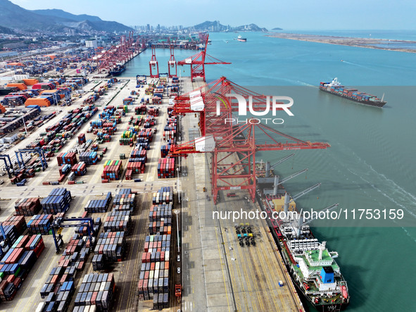 Cargo ships stop at their berths to load and unload containers at the container terminal in Lianyungang Port in Lianyungang, China, on Novem...