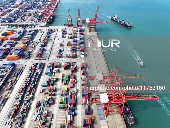 Cargo ships stop at their berths to load and unload containers at the container terminal in Lianyungang Port in Lianyungang, China, on Novem...