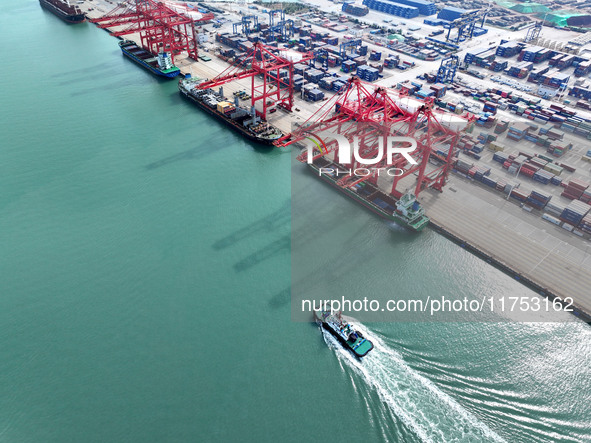 Cargo ships stop at their berths to load and unload containers at the container terminal in Lianyungang Port in Lianyungang, China, on Novem...