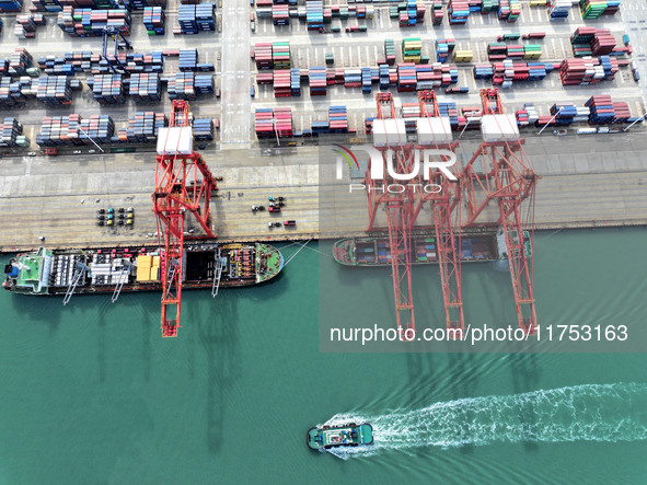 Cargo ships stop at their berths to load and unload containers at the container terminal in Lianyungang Port in Lianyungang, China, on Novem...