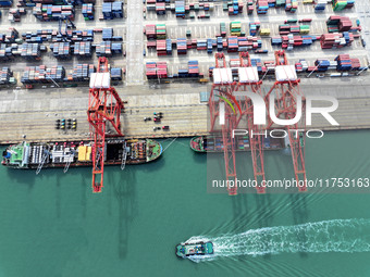 Cargo ships stop at their berths to load and unload containers at the container terminal in Lianyungang Port in Lianyungang, China, on Novem...