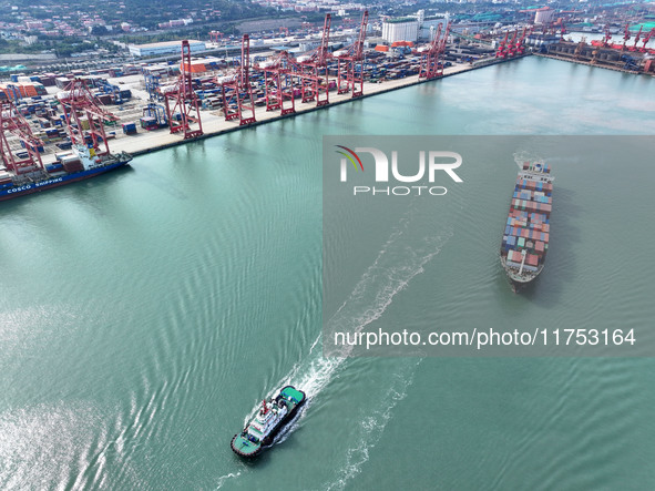 Cargo ships stop at their berths to load and unload containers at the container terminal in Lianyungang Port in Lianyungang, China, on Novem...