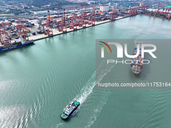 Cargo ships stop at their berths to load and unload containers at the container terminal in Lianyungang Port in Lianyungang, China, on Novem...