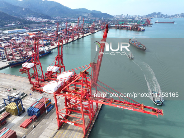 Cargo ships stop at their berths to load and unload containers at the container terminal in Lianyungang Port in Lianyungang, China, on Novem...