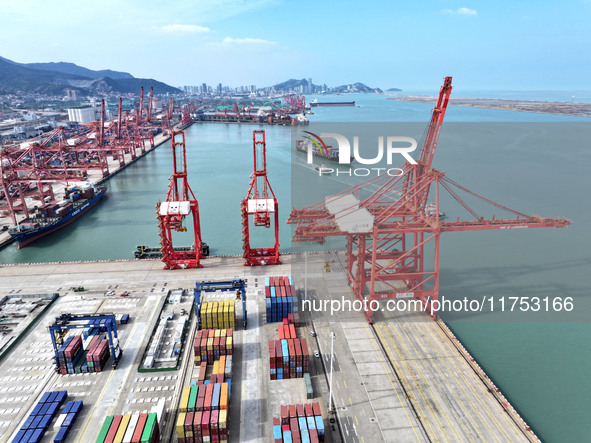 Cargo ships stop at their berths to load and unload containers at the container terminal in Lianyungang Port in Lianyungang, China, on Novem...