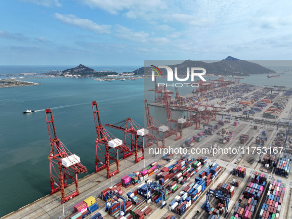 Cargo ships stop at their berths to load and unload containers at the container terminal in Lianyungang Port in Lianyungang, China, on Novem...