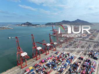 Cargo ships stop at their berths to load and unload containers at the container terminal in Lianyungang Port in Lianyungang, China, on Novem...