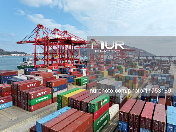 Cargo ships stop at their berths to load and unload containers at the container terminal in Lianyungang Port in Lianyungang, China, on Novem...