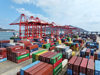 Cargo ships stop at their berths to load and unload containers at the container terminal in Lianyungang Port in Lianyungang, China, on Novem...