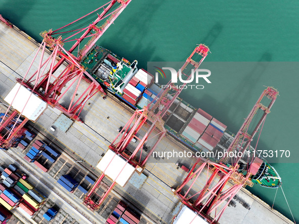 Cargo ships stop at their berths to load and unload containers at the container terminal in Lianyungang Port in Lianyungang, China, on Novem...