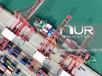 Cargo ships stop at their berths to load and unload containers at the container terminal in Lianyungang Port in Lianyungang, China, on Novem...