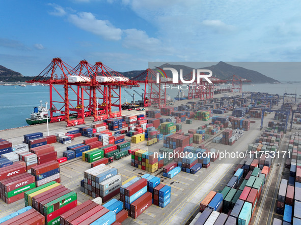 Cargo ships stop at their berths to load and unload containers at the container terminal in Lianyungang Port in Lianyungang, China, on Novem...