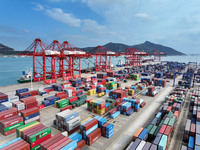 Cargo ships stop at their berths to load and unload containers at the container terminal in Lianyungang Port in Lianyungang, China, on Novem...