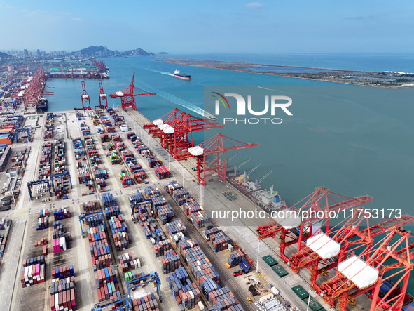 Cargo ships stop at their berths to load and unload containers at the container terminal in Lianyungang Port in Lianyungang, China, on Novem...