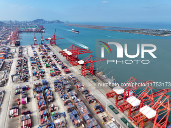 Cargo ships stop at their berths to load and unload containers at the container terminal in Lianyungang Port in Lianyungang, China, on Novem...