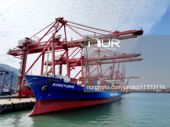 Cargo ships stop at their berths to load and unload containers at the container terminal in Lianyungang Port in Lianyungang, China, on Novem...