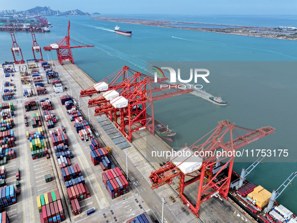 Cargo ships stop at their berths to load and unload containers at the container terminal in Lianyungang Port in Lianyungang, China, on Novem...