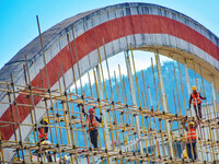 Workers carry out maintenance work on the Nanyuan Bridge in Yuexi County, Anqing City, East China's Anhui Province, on November 8, 2024. (